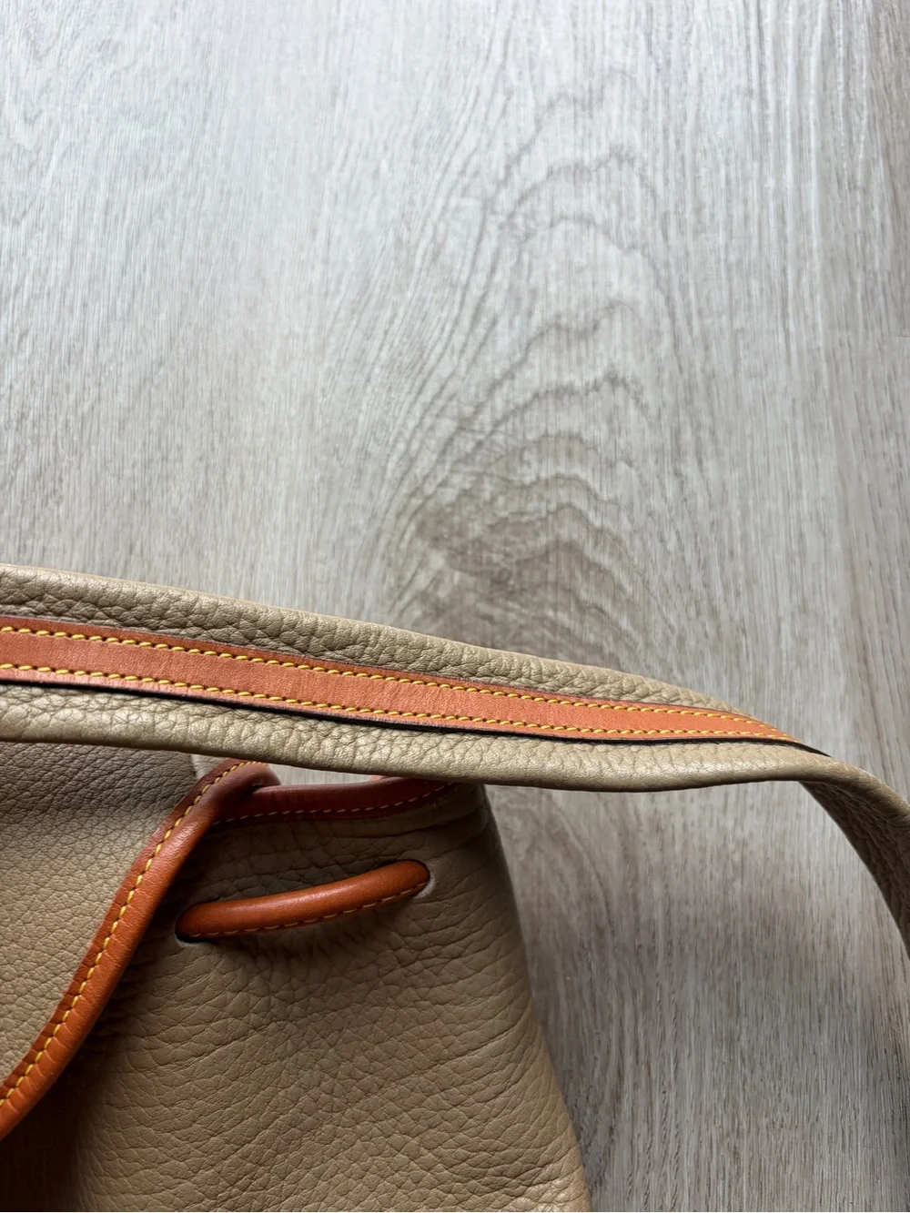 Dooney & Bourke Beige Leather Drawstring Backpack with Tan Trim